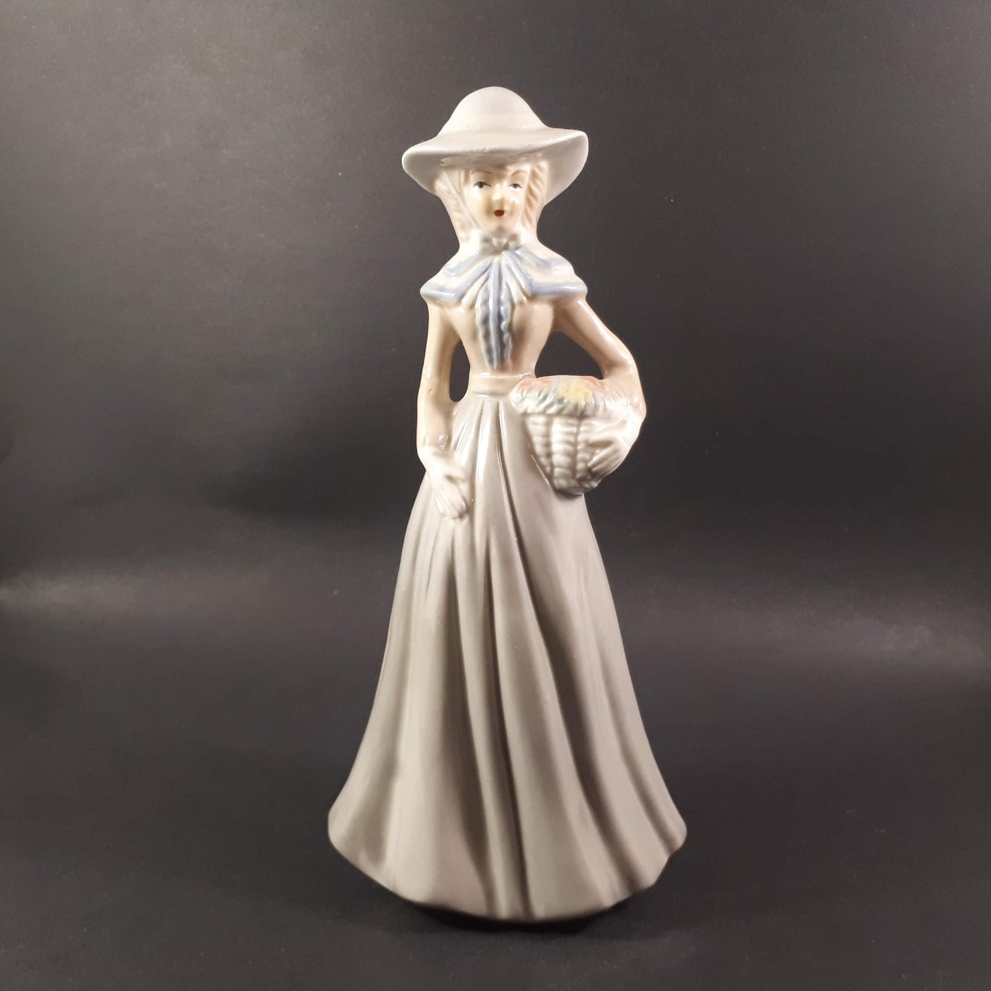 Beautiful Vintage European styled lady holding flower basket 8 " inches porcelain