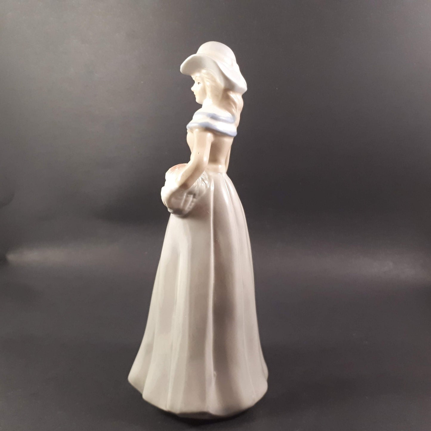 Beautiful Vintage European styled lady holding flower basket 8 " inches porcelain