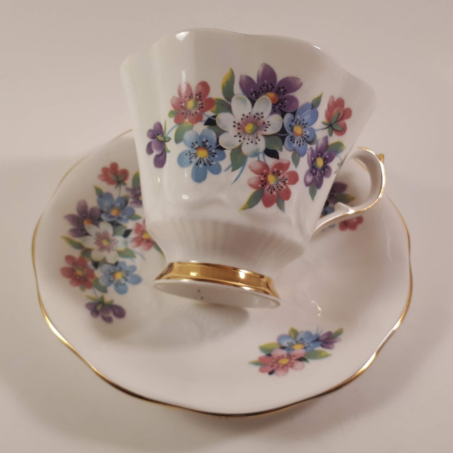Gorgeous Queen Anne multicolored floral bone china teacup and saucer