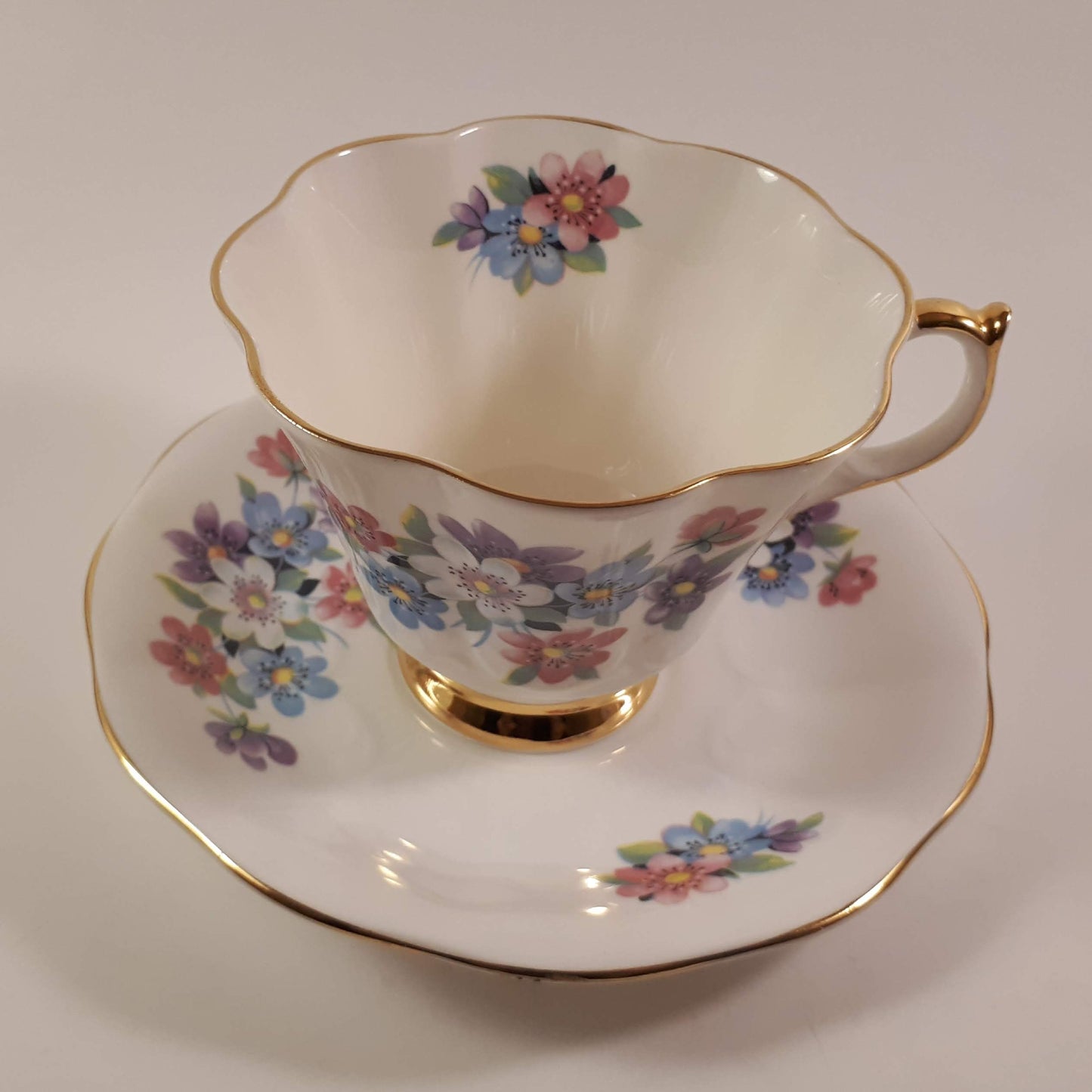 Gorgeous Queen Anne multicolored floral bone china teacup and saucer