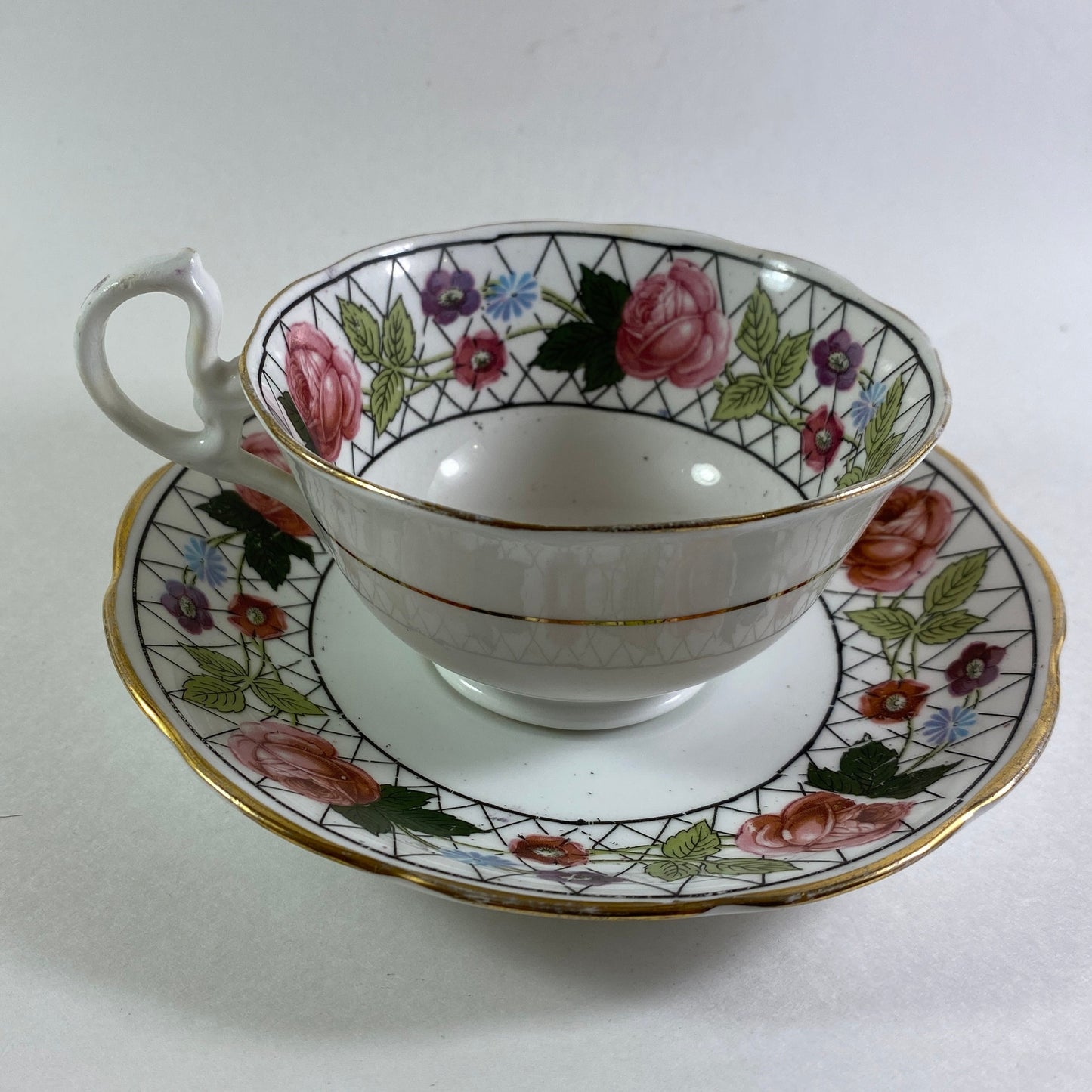 Antique Crown England floral bone china teacup and saucer