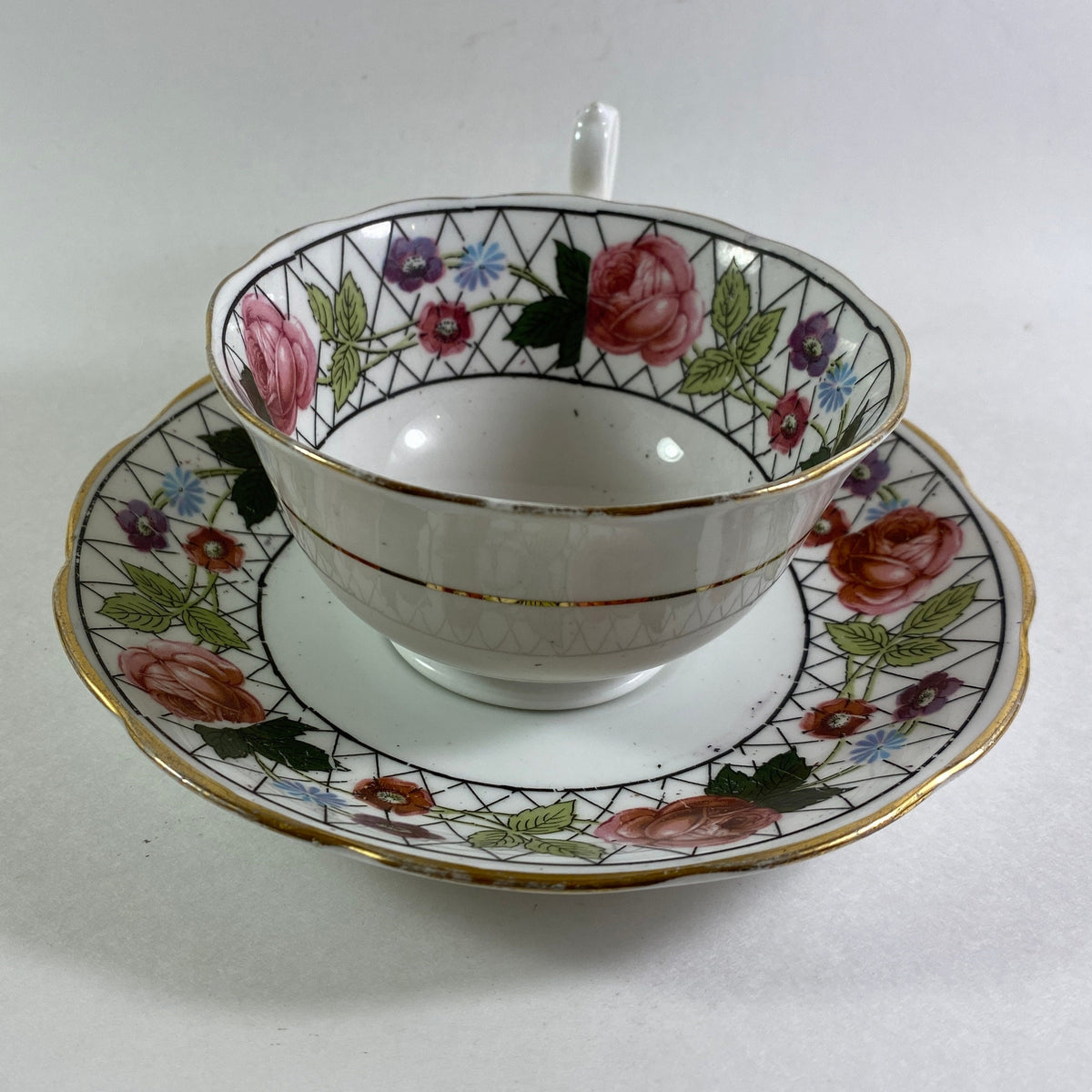 Antique Crown England floral bone china teacup and saucer