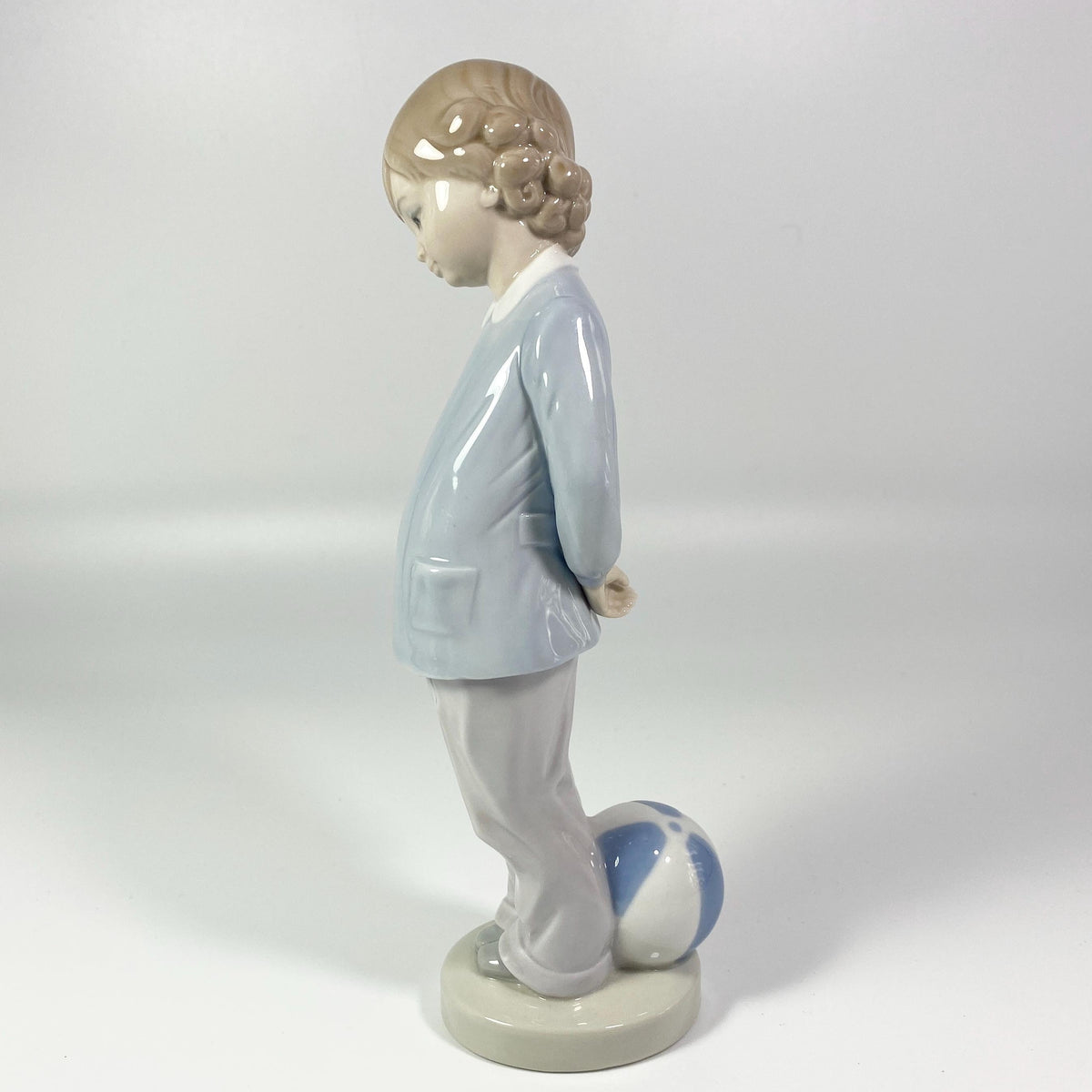 Lladro Porcelain Figurine: Boy w/beach ball #4899 "Punishment" - retired in 1983