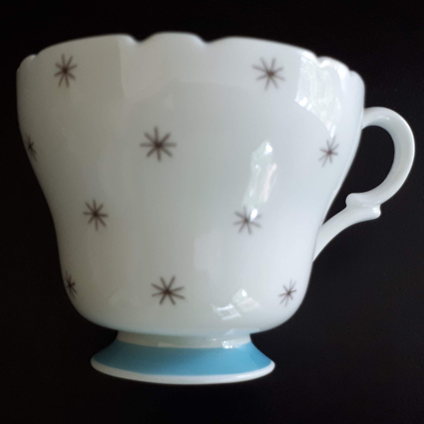 Shelley unique white cup with stars outside and sky blue interior