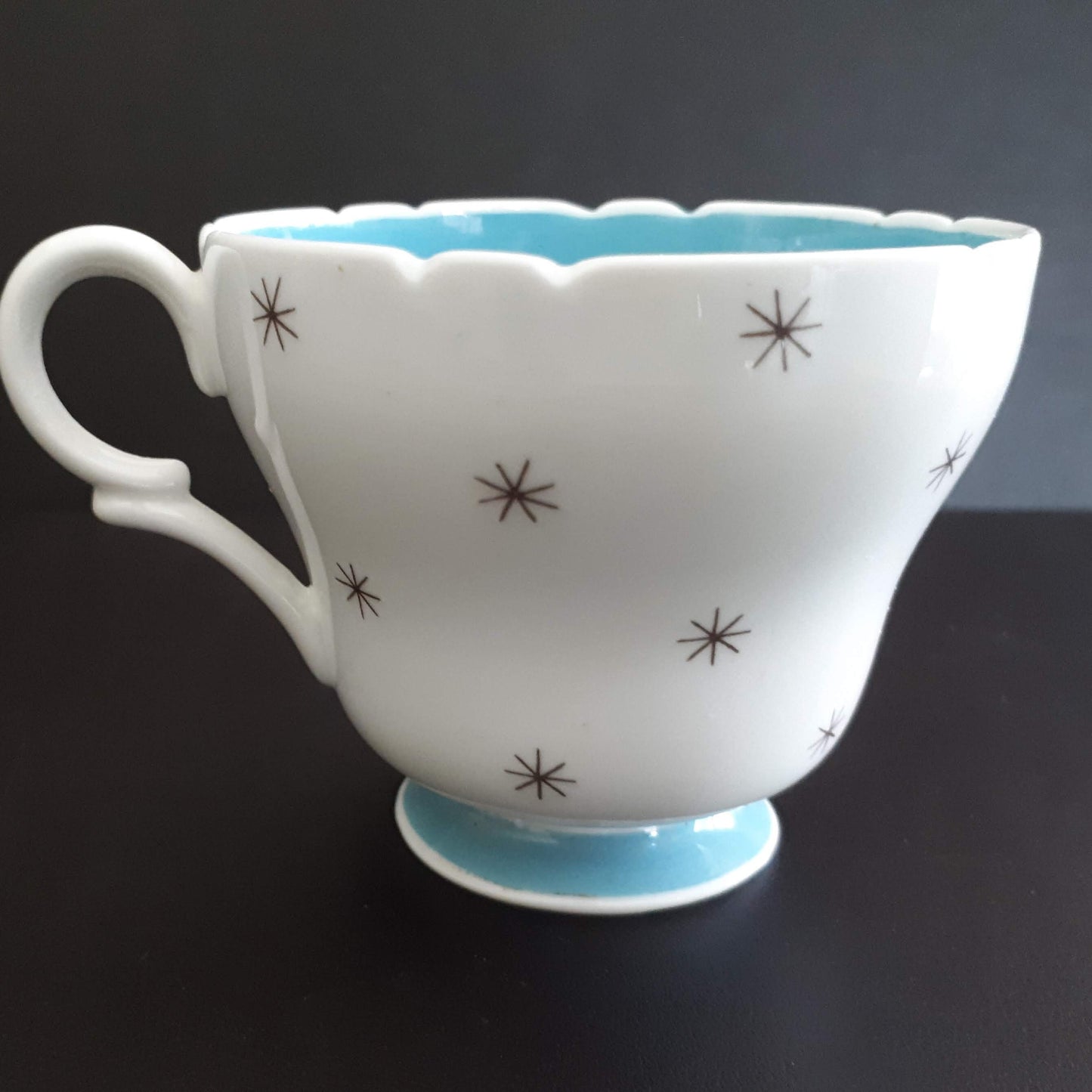 Shelley unique white cup with stars outside and sky blue interior