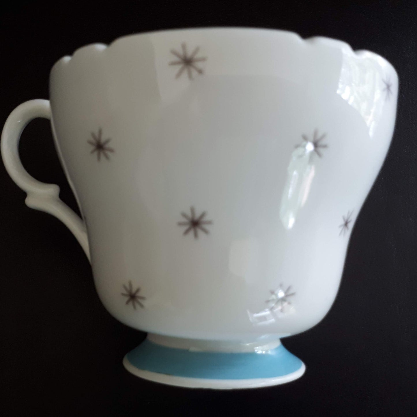 Shelley unique white cup with stars outside and sky blue interior