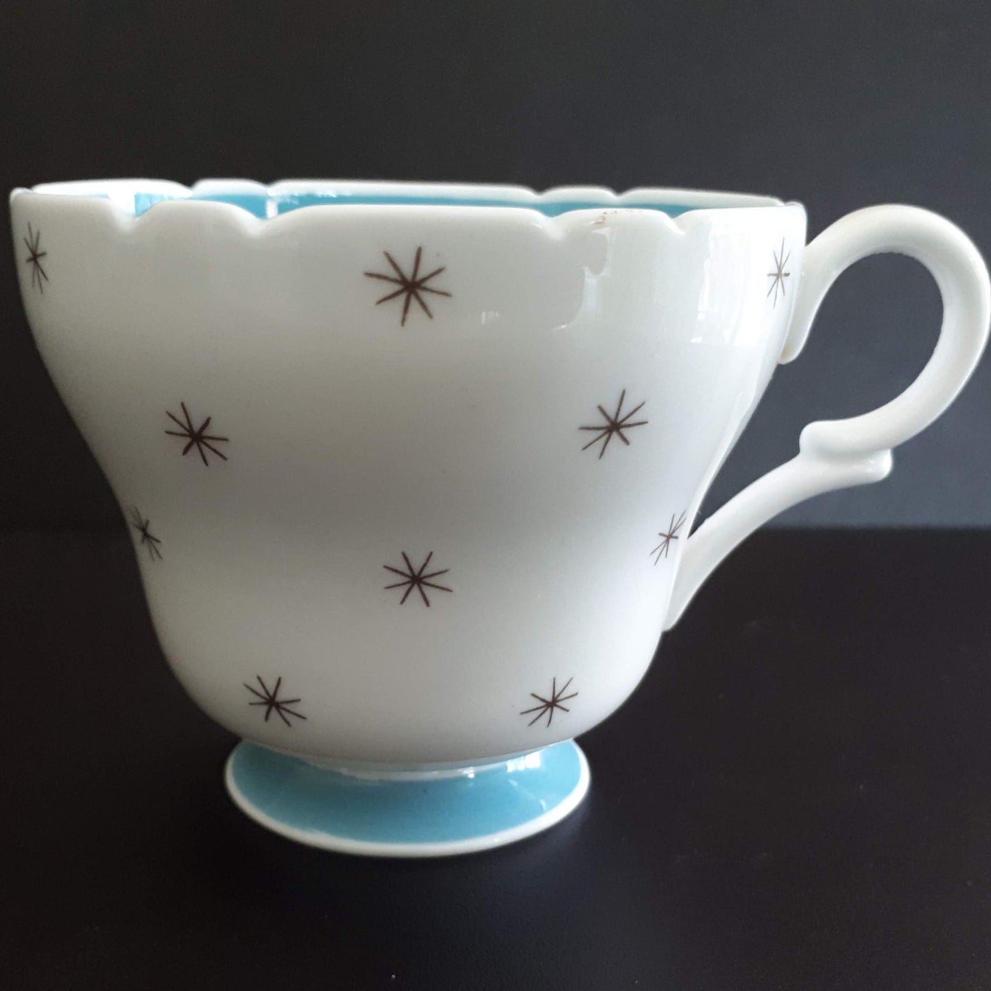 Shelley unique white cup with stars outside and sky blue interior