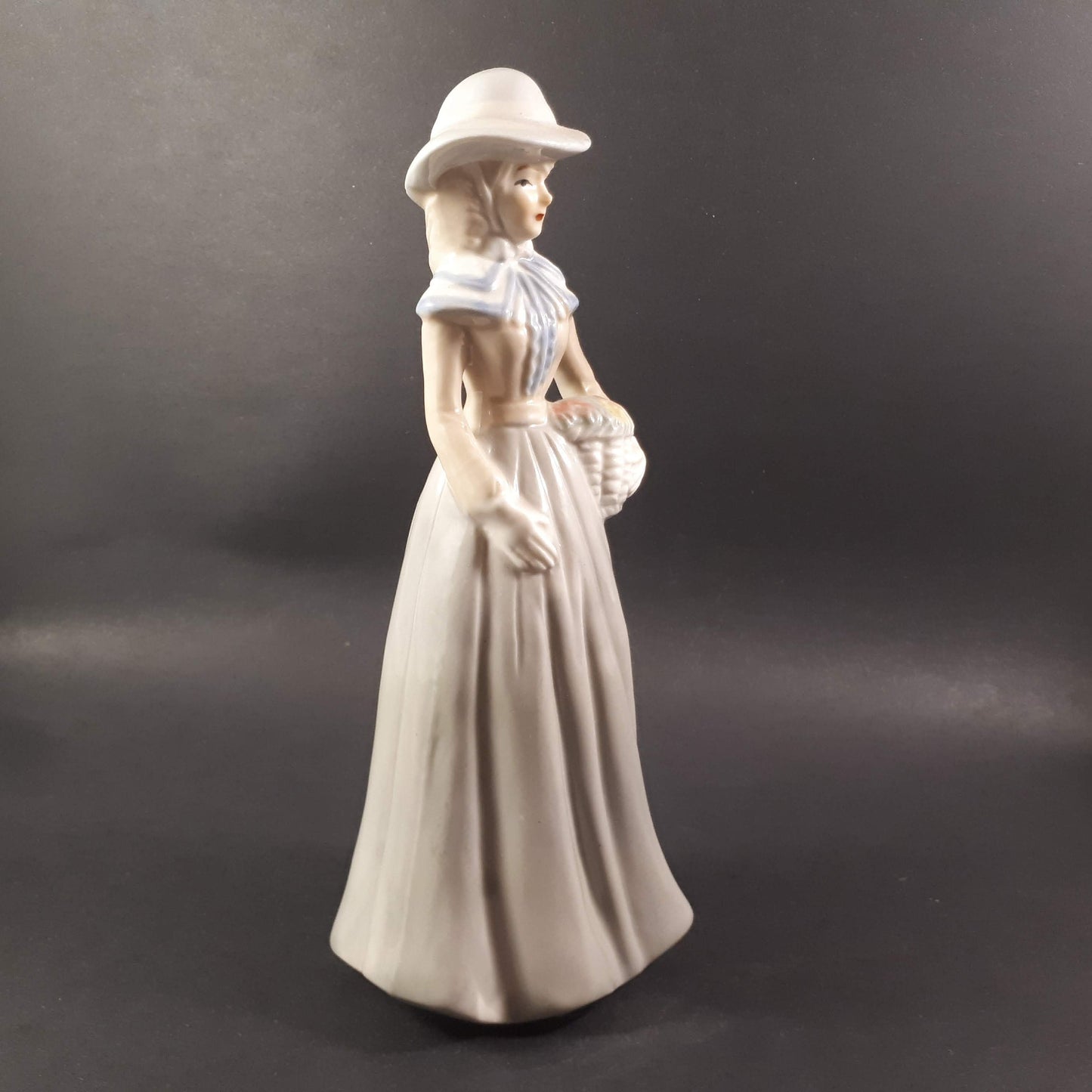 Beautiful Vintage European styled lady holding flower basket 8 " inches porcelain