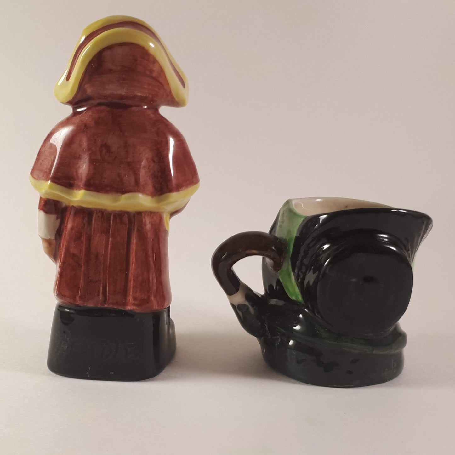 Set of Royal Doulton small toby mug and Artone England beadley figurine