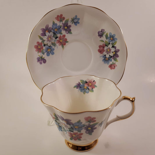 Gorgeous Queen Anne multicolored floral bone china teacup and saucer