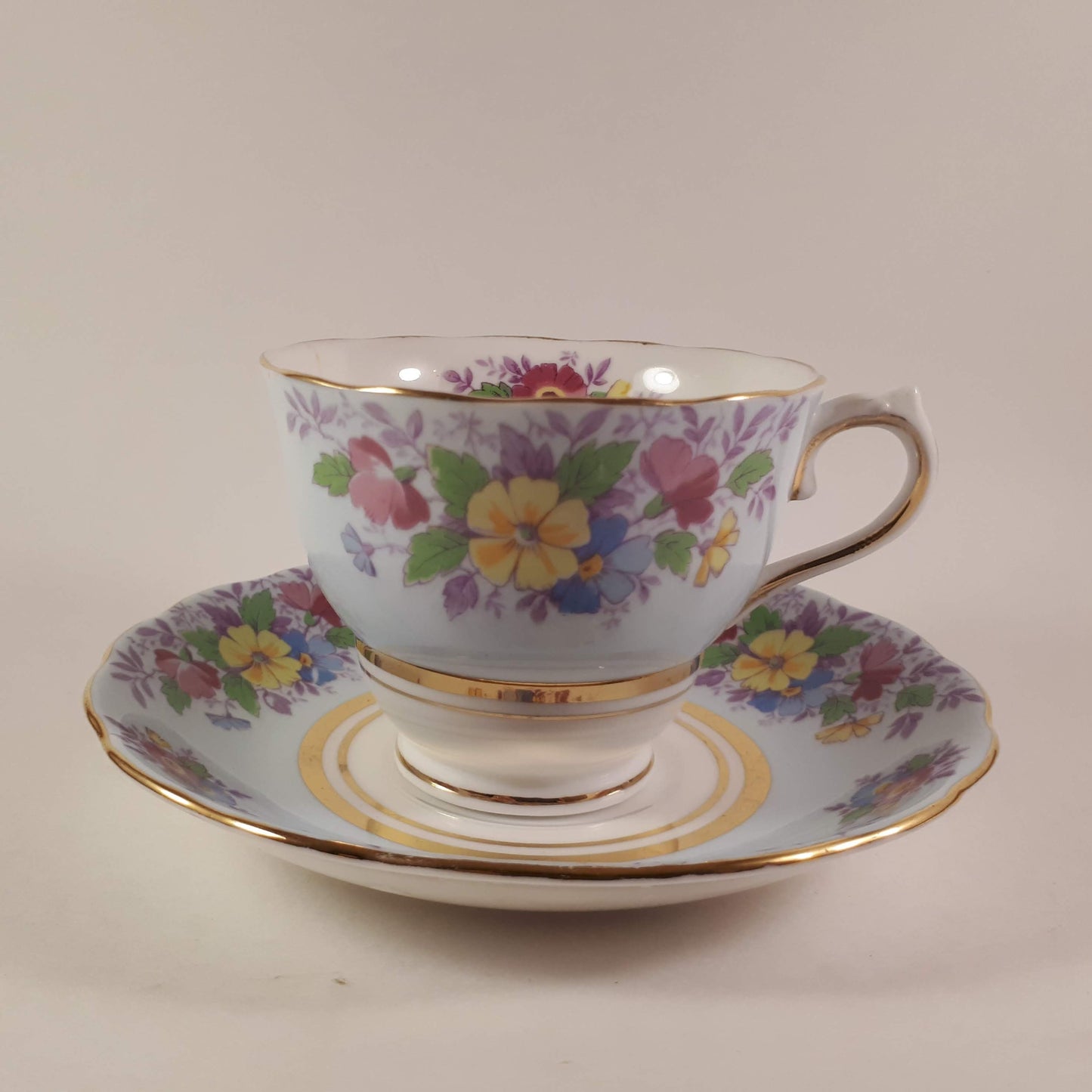 Colclough tea cup and saucer Made In England bone china. Blue floral.