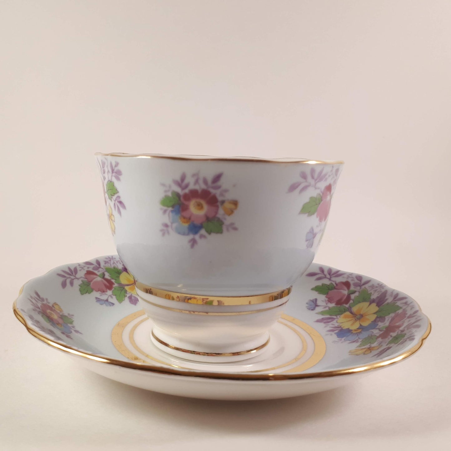 Colclough tea cup and saucer Made In England bone china. Blue floral.