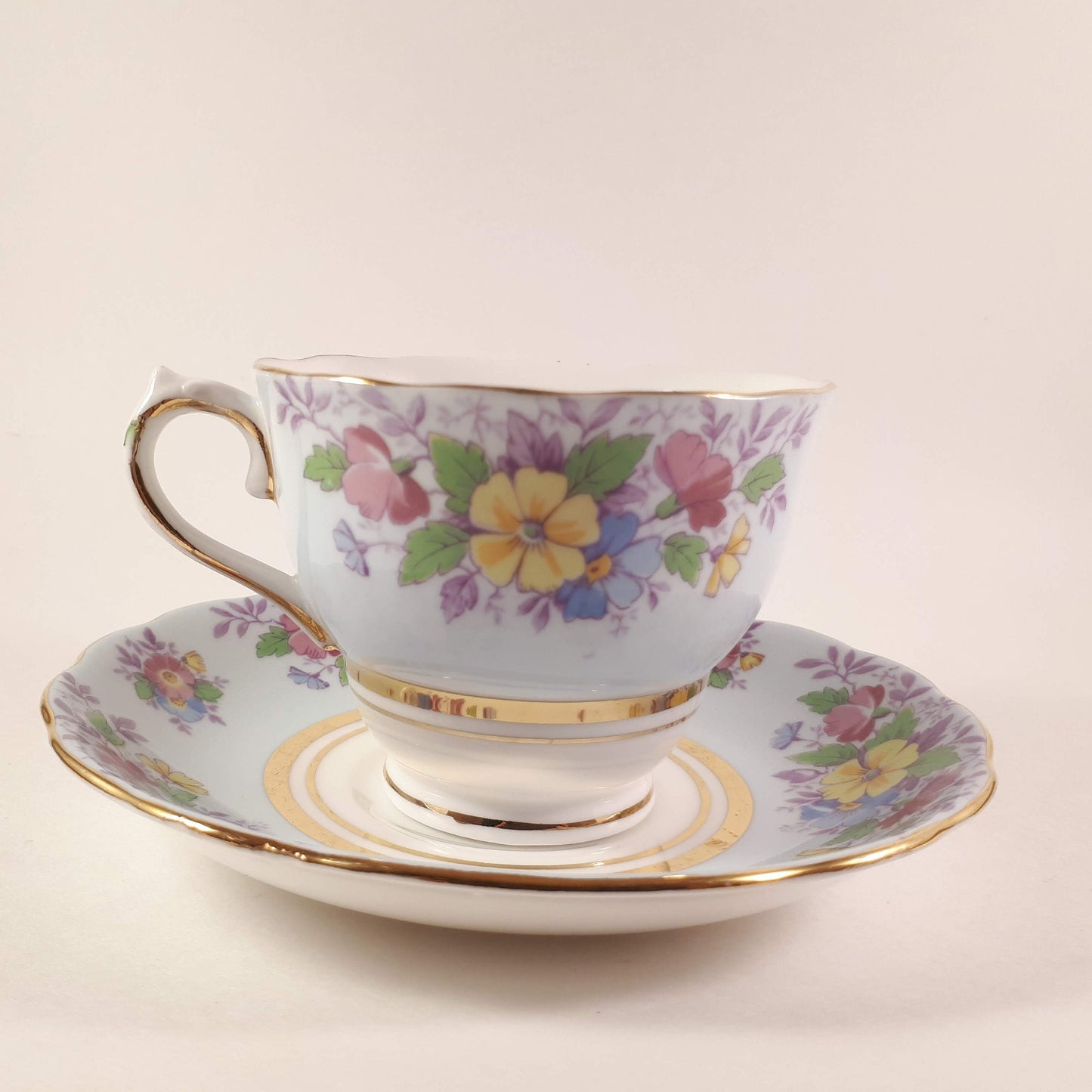 Colclough tea cup and saucer Made In England bone china. Blue floral.