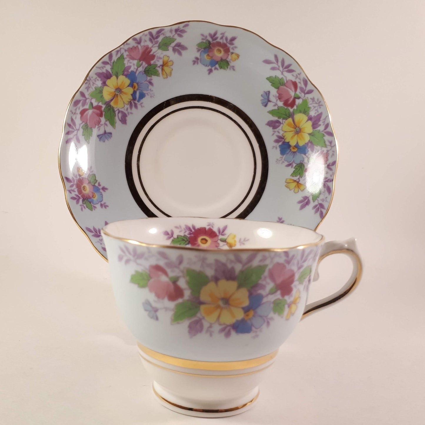Colclough tea cup and saucer Made In England bone china. Blue floral.