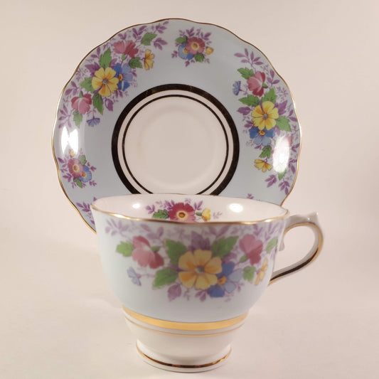 Colclough tea cup and saucer Made In England bone china. Blue floral.
