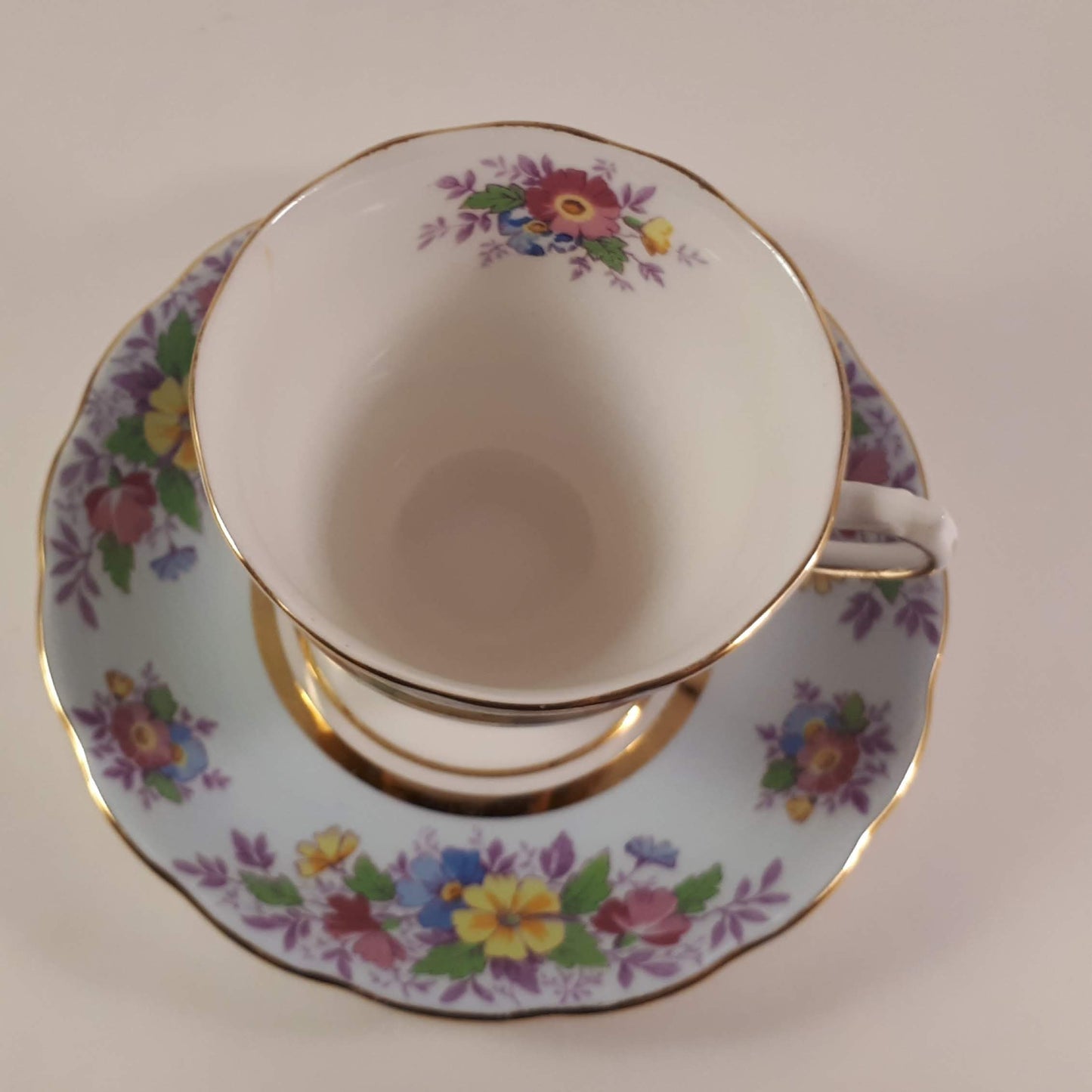 Colclough tea cup and saucer Made In England bone china. Blue floral.