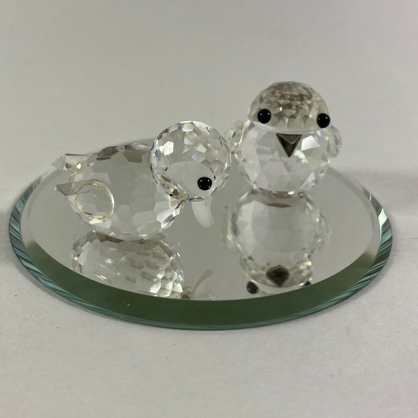 Swarovski two little birds sparkling figurines with display mirror.