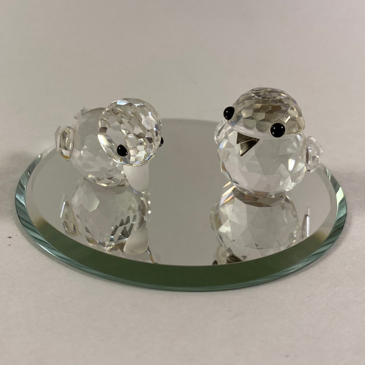 Swarovski two little birds sparkling figurines with display mirror.
