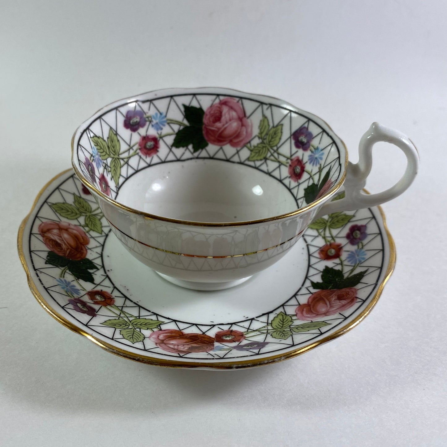 Antique Crown England floral bone china teacup and saucer