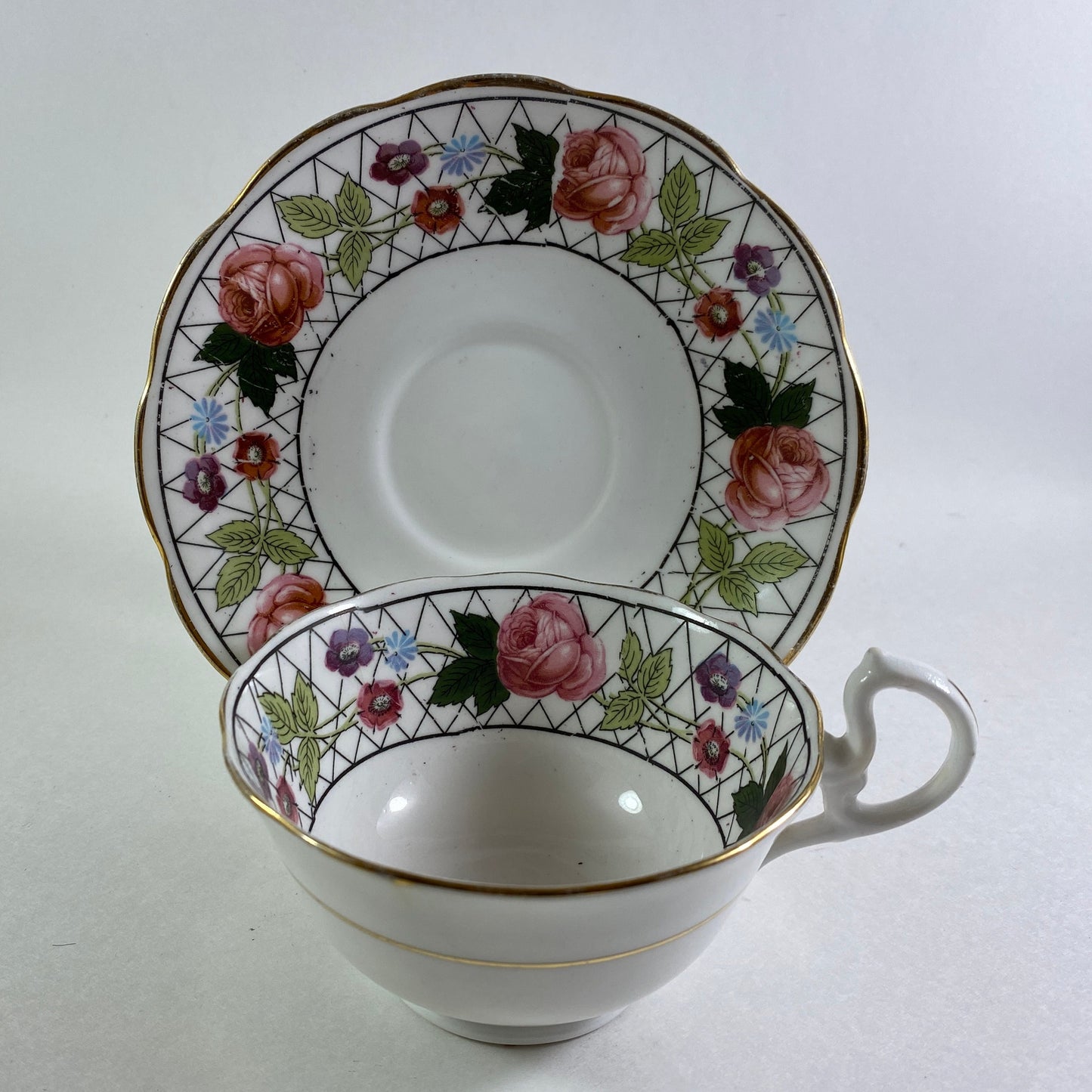 Antique Crown England floral bone china teacup and saucer