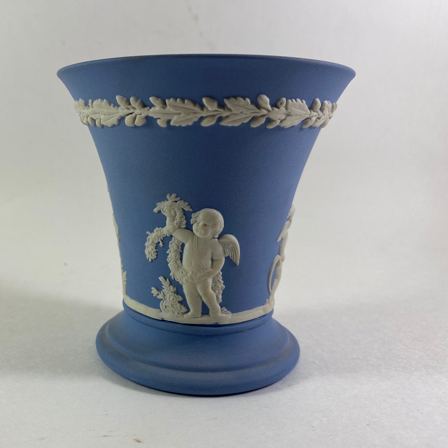 Wedgwood Blue Jasperware cherub design trumpet Vase