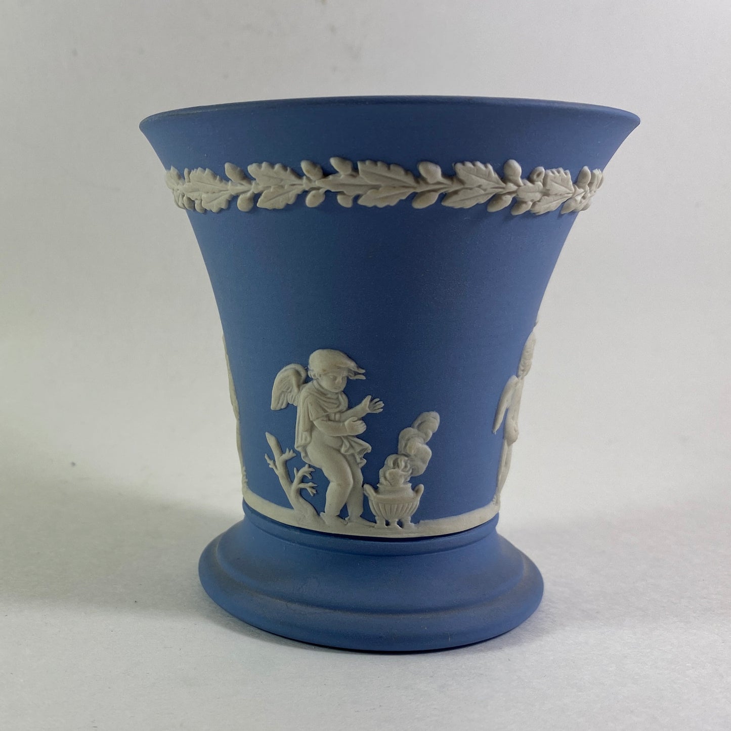 Wedgwood Blue Jasperware cherub design trumpet Vase