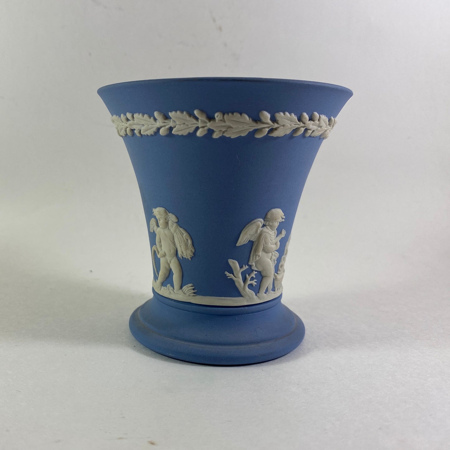 Wedgwood Blue Jasperware cherub design trumpet Vase