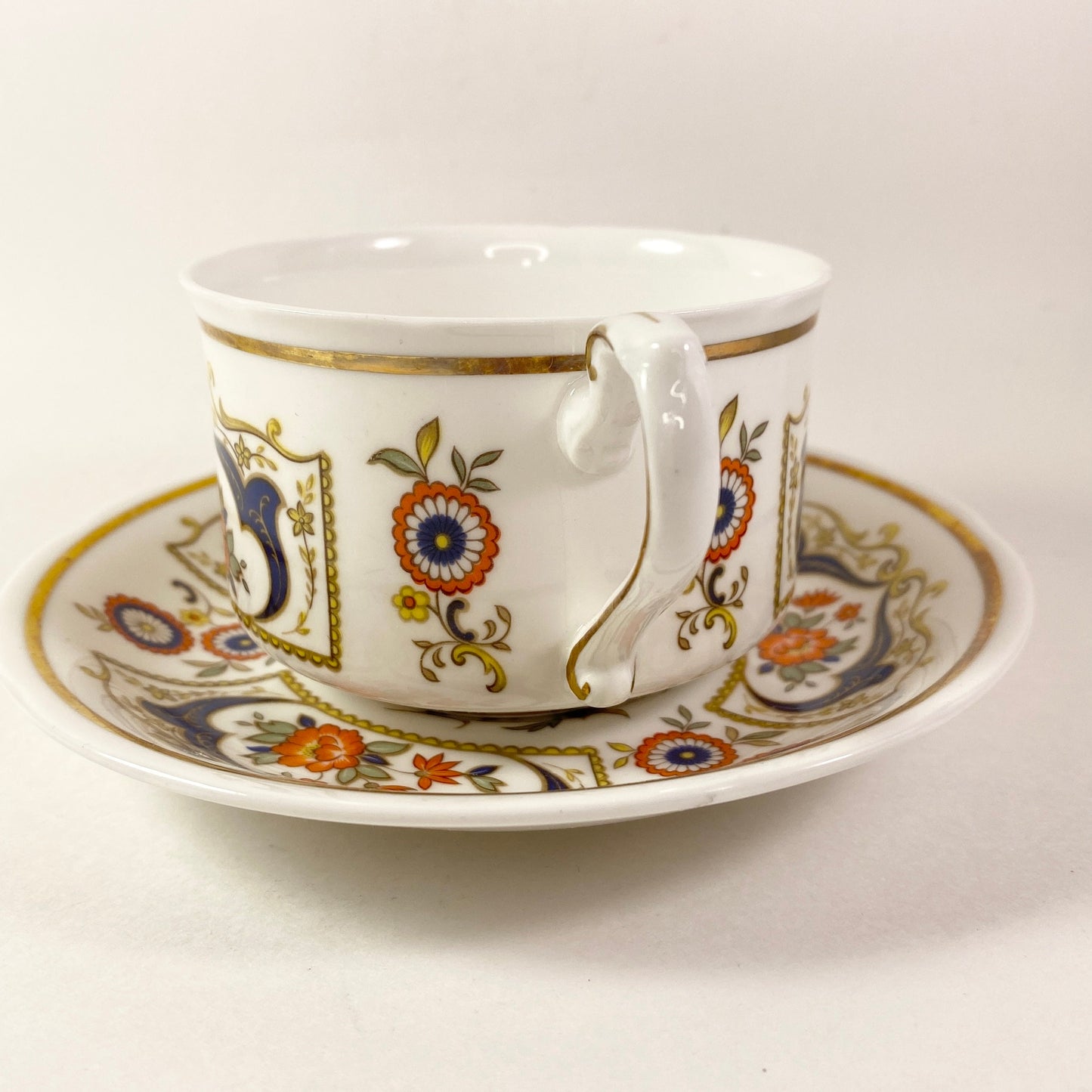 Exteremly RARE Paragon Chelsea Rust Flowers, Blue yellow scrolls teacup saucer