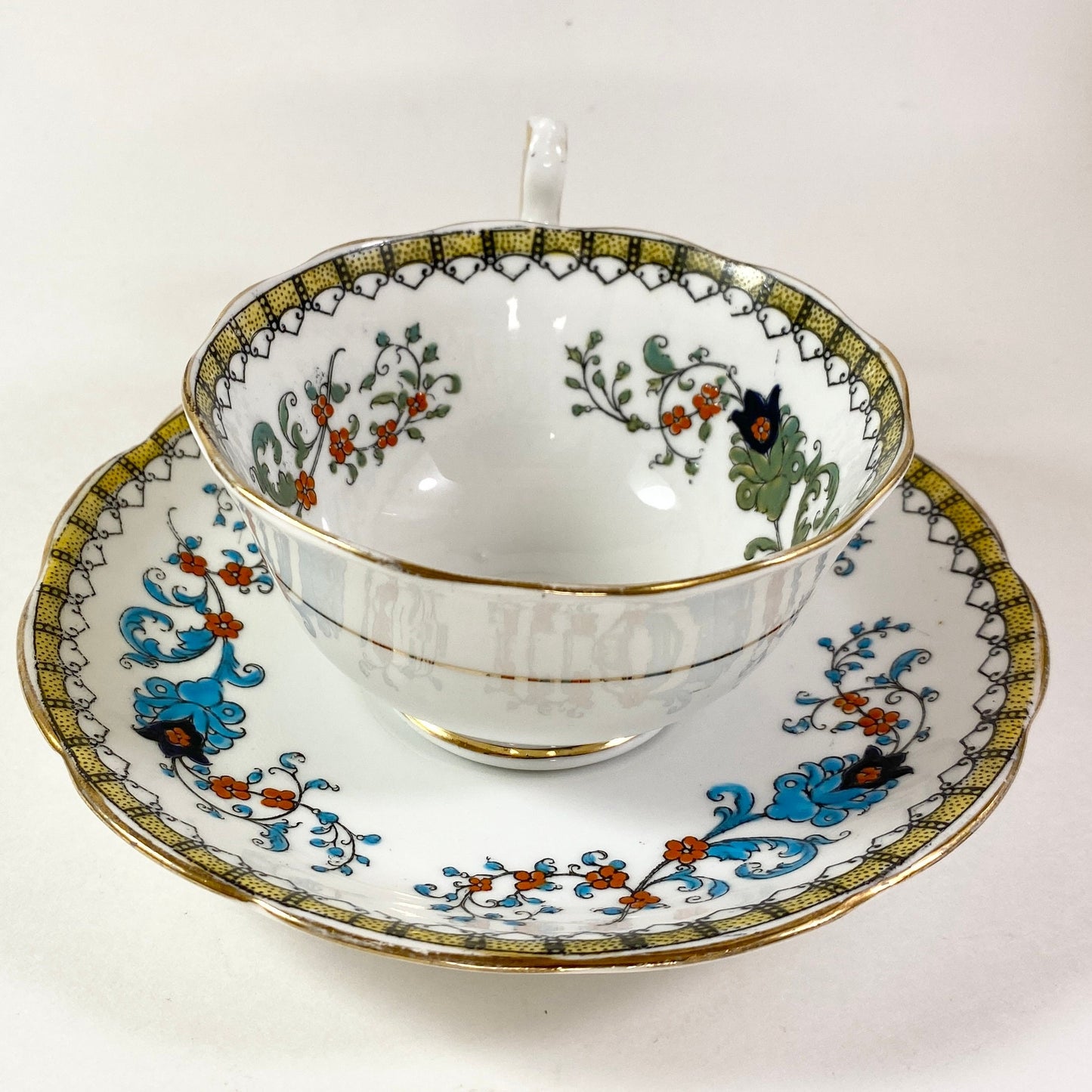 Antique Royal Albert crown china wide mouthed hand painted teacup and saucer