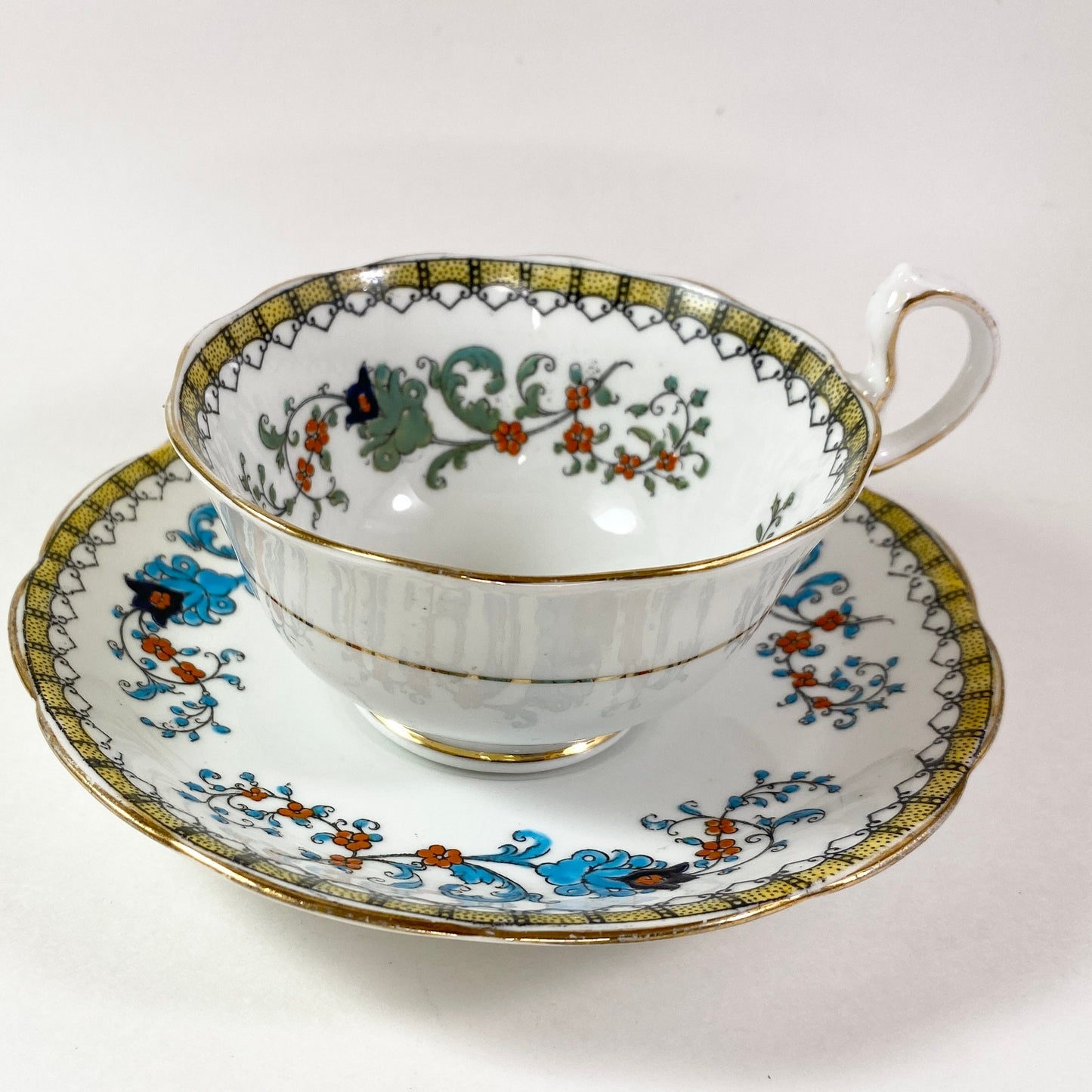 Antique Royal Albert crown china wide mouthed hand painted teacup and saucer