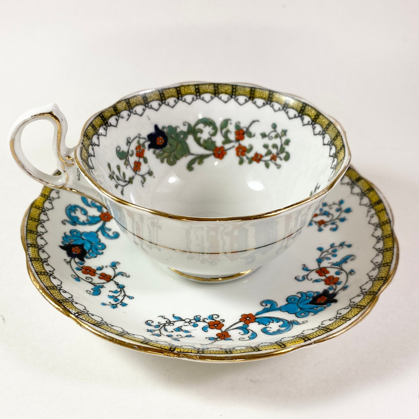 Antique Royal Albert crown china wide mouthed hand painted teacup and saucer