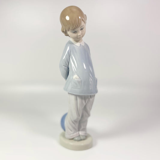 Lladro Porcelain Figurine: Boy w/beach ball #4899 "Punishment" - retired in 1983