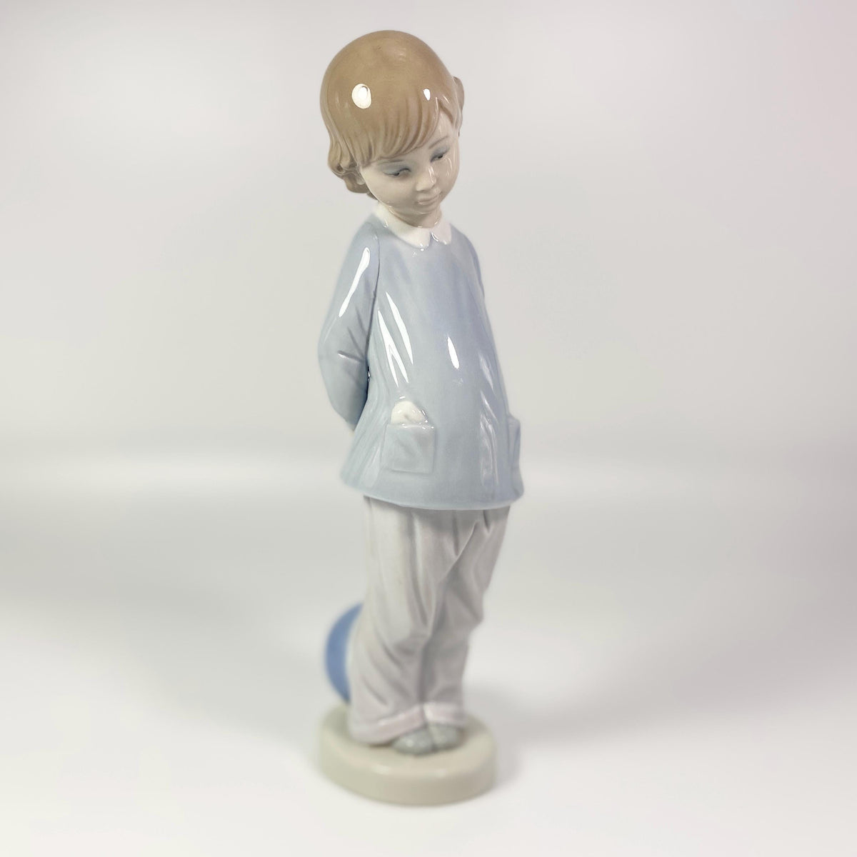 Lladro Porcelain Figurine: Boy w/beach ball #4899 "Punishment" - retired in 1983