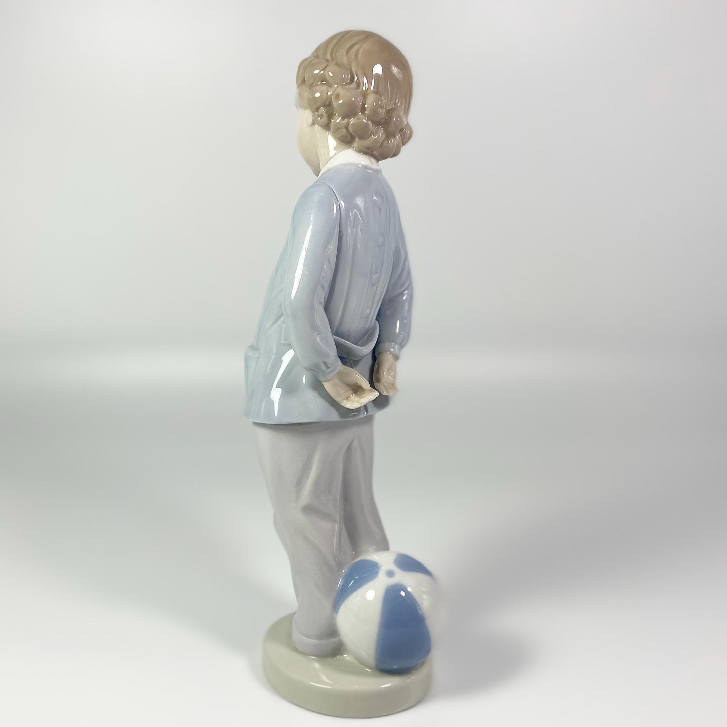 Lladro Porcelain Figurine: Boy w/beach ball #4899 "Punishment" - retired in 1983