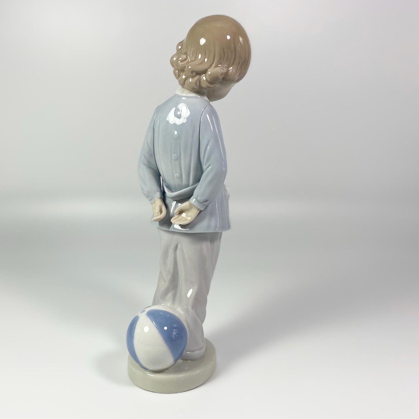 Lladro Porcelain Figurine: Boy w/beach ball #4899 "Punishment" - retired in 1983