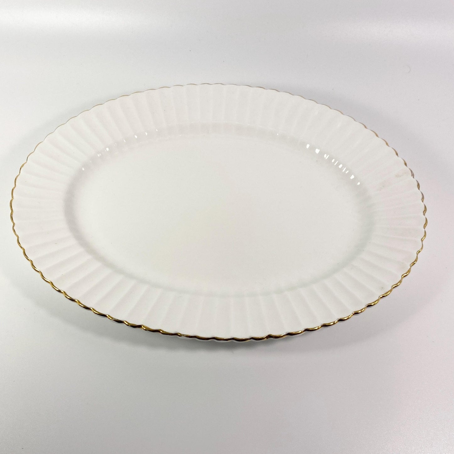 Paragon all white oval serving platter 13 " Fluted rim gold trim