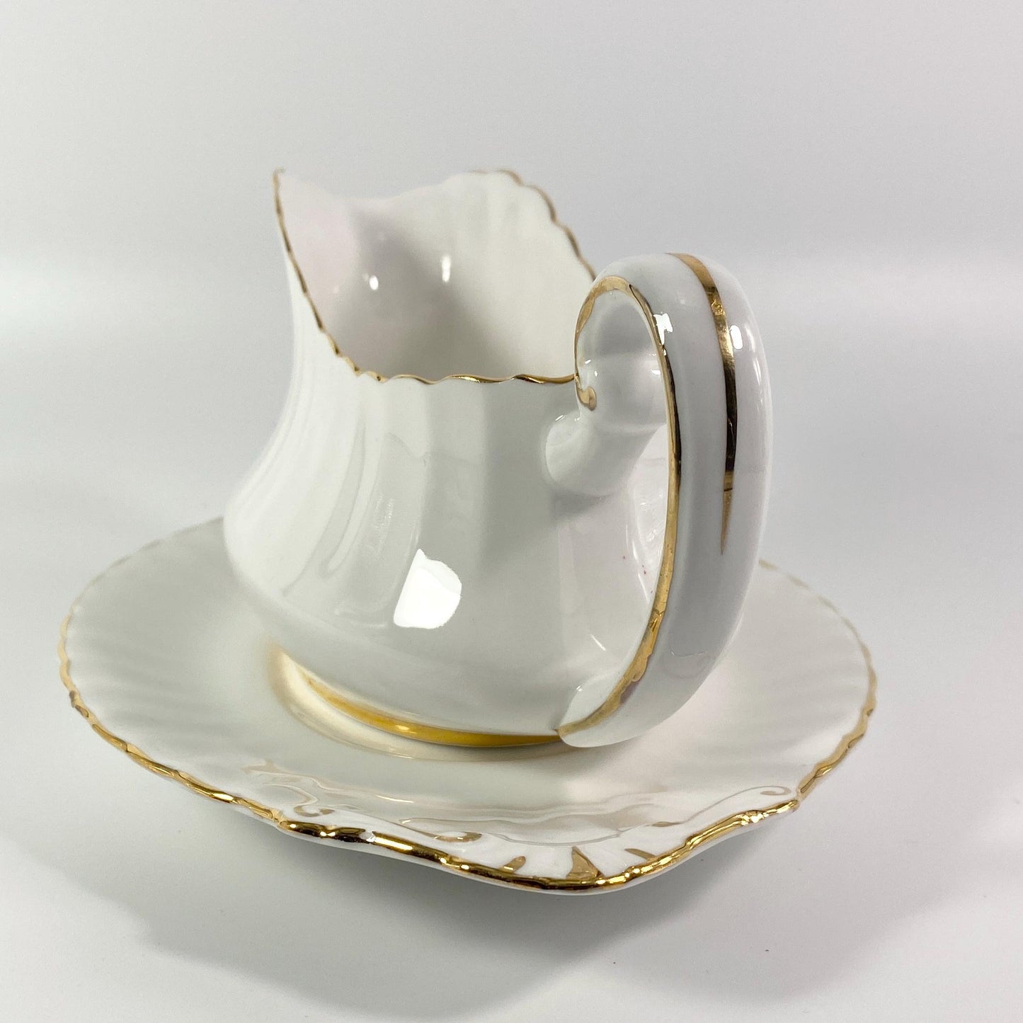 Paragon Gravy or Sauce Boat with plate,  White with gold Trim vintage England